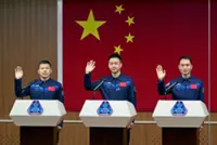 Astronauts return to Earth after nine-day delay