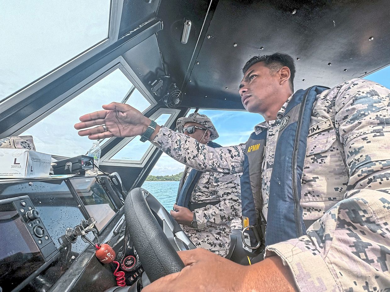 Renewed risks: Malaysian rescuers approach a jetty after rescuing Rohingya migrant Iman Shorif (left), days after his boat carrying fellow refugees from Myanmar capsized near Langkawi. — AFP