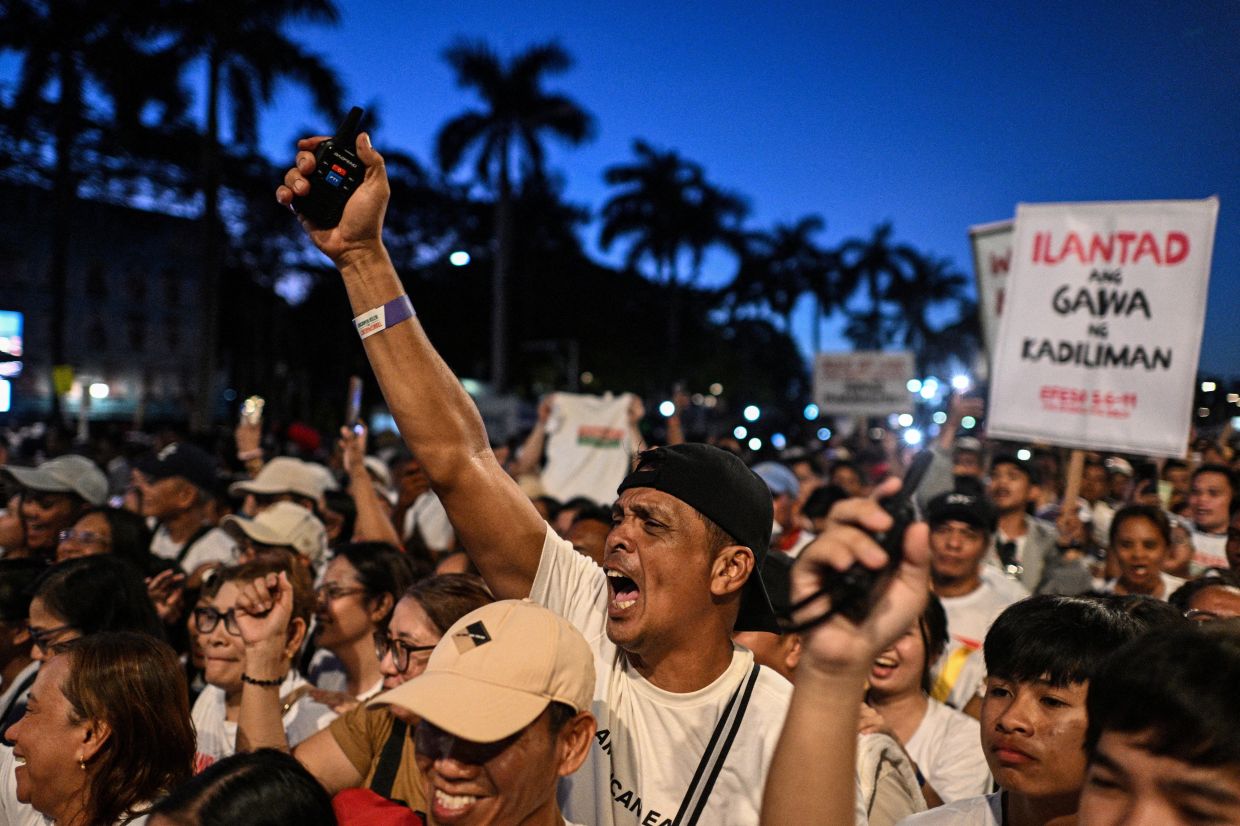 A member of the religious group Iglesia ni Cristo (Church of Christ) shouts slogans during the first of a three-day anti-corruption protest at the Quirino Grandstand, Manila, Philippines, on Sunday, November 16, 2025.Photo: REUTERS/Noel Celis