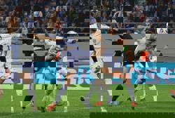 Soccer-Scotland lose to Greece but handed a lifeline by Danes' draw with Belarus