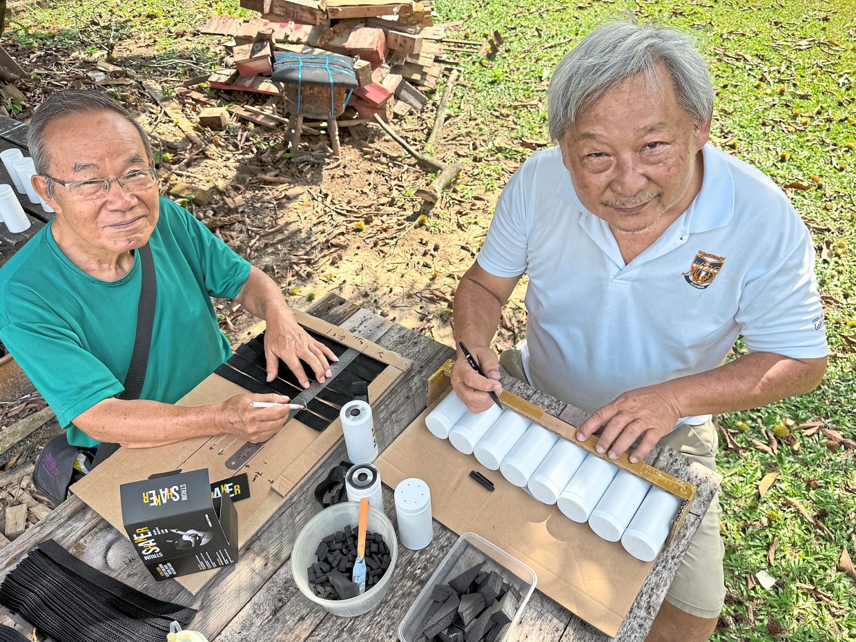 Chong (left) and Ng are in charge of making Lim’s percussion instrument.