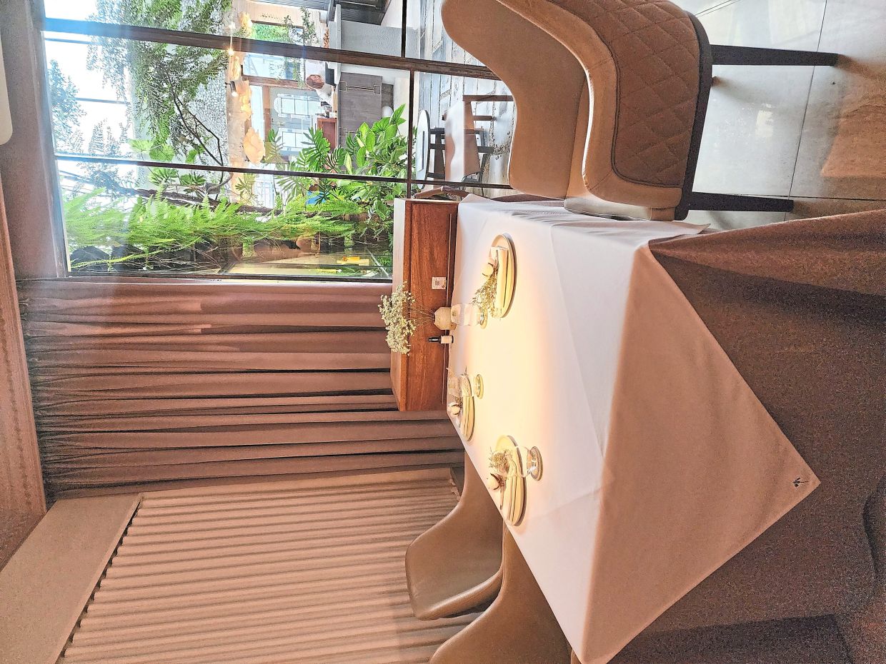 The eatery has an easy, sophisticated charm that is boosted by the foliage scattered throughout. — Photo: ABIRAMI DURAI/The Star