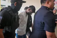 Two men charged with murdering saleswoman