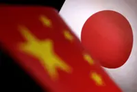 China escalates Japan spat with threats of economic reprisal