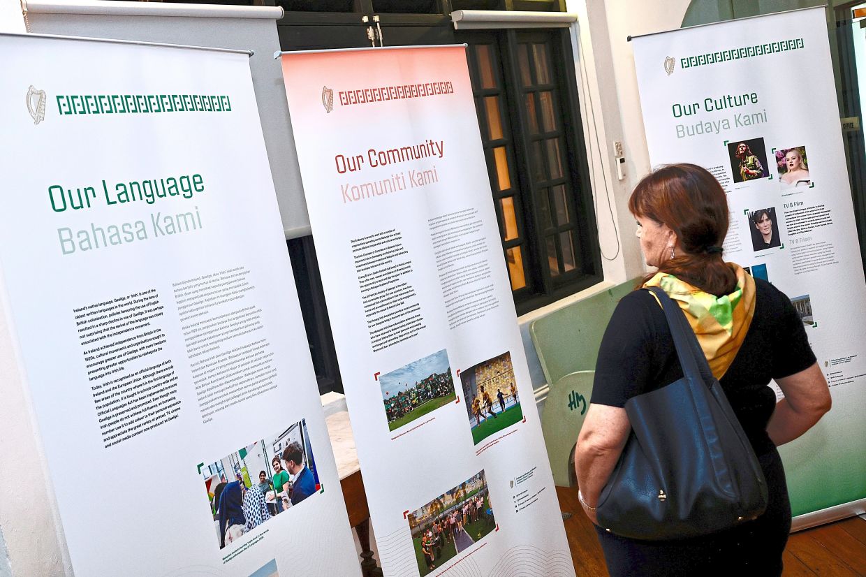 A visitor looking at panels relating Ireland and Malaysia’s friendship.