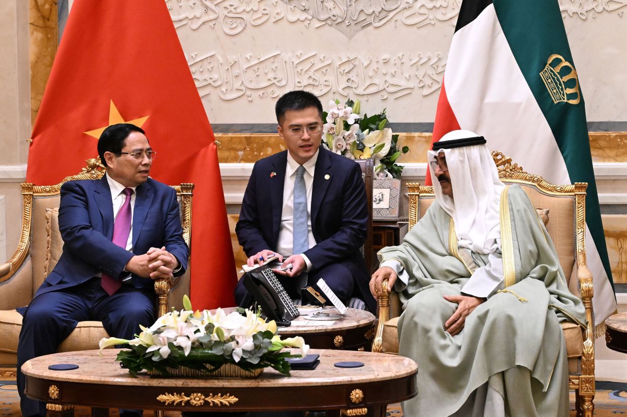 Emir of Kuwait Meshal al-Ahmad al-Jaber al-Sabah meeting Vietnamese Prime Minister Pham Minh Chinh at Kuwait international airport in Kuwait City on Nov 17, 2025. - AFP