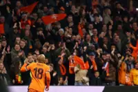 Soccer-Dutch ensure World Cup qualification with 4-0 win over Lithuania