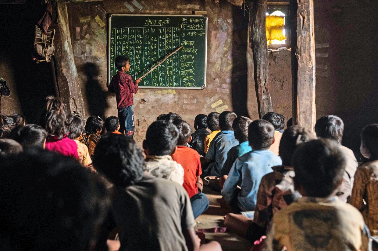 Students attend a class inside a one-room school at Khaparmal village, in the drought-prone district of Nandurbar. Photo: SHEFALI RAFIQ/AFP