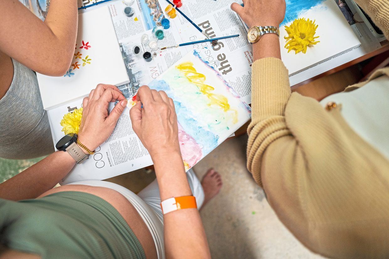 At Grow Sessions, attendees engaged in workshops and empowering experiences, while exploring self-discovery through journalling sessions. Photo: Women Wellness Festival