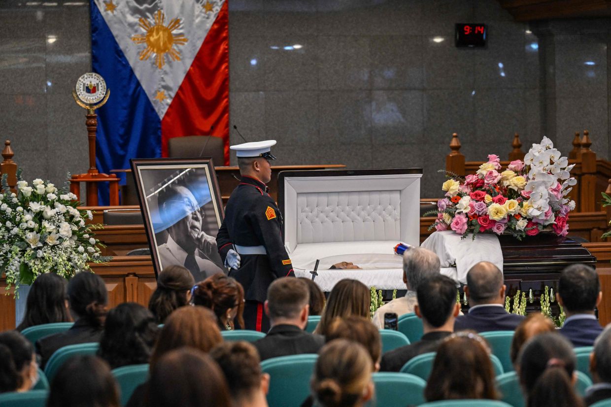Juan Ponce Enrile, a long-time top adviser to late Philippine dictator Ferdinand Marcos, lies in state in a coffin at the Senate in Manila on Nov 19, 2025. Enrile, a shrewd political operator who helped usher in the darkest repression of the late Philippine dictator Ferdinand Marcos's rule, died on Nov13 at the age of 101. - AFP
