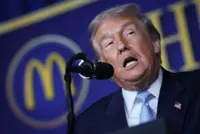 Trump hails McDonald’s deal in cost pitch