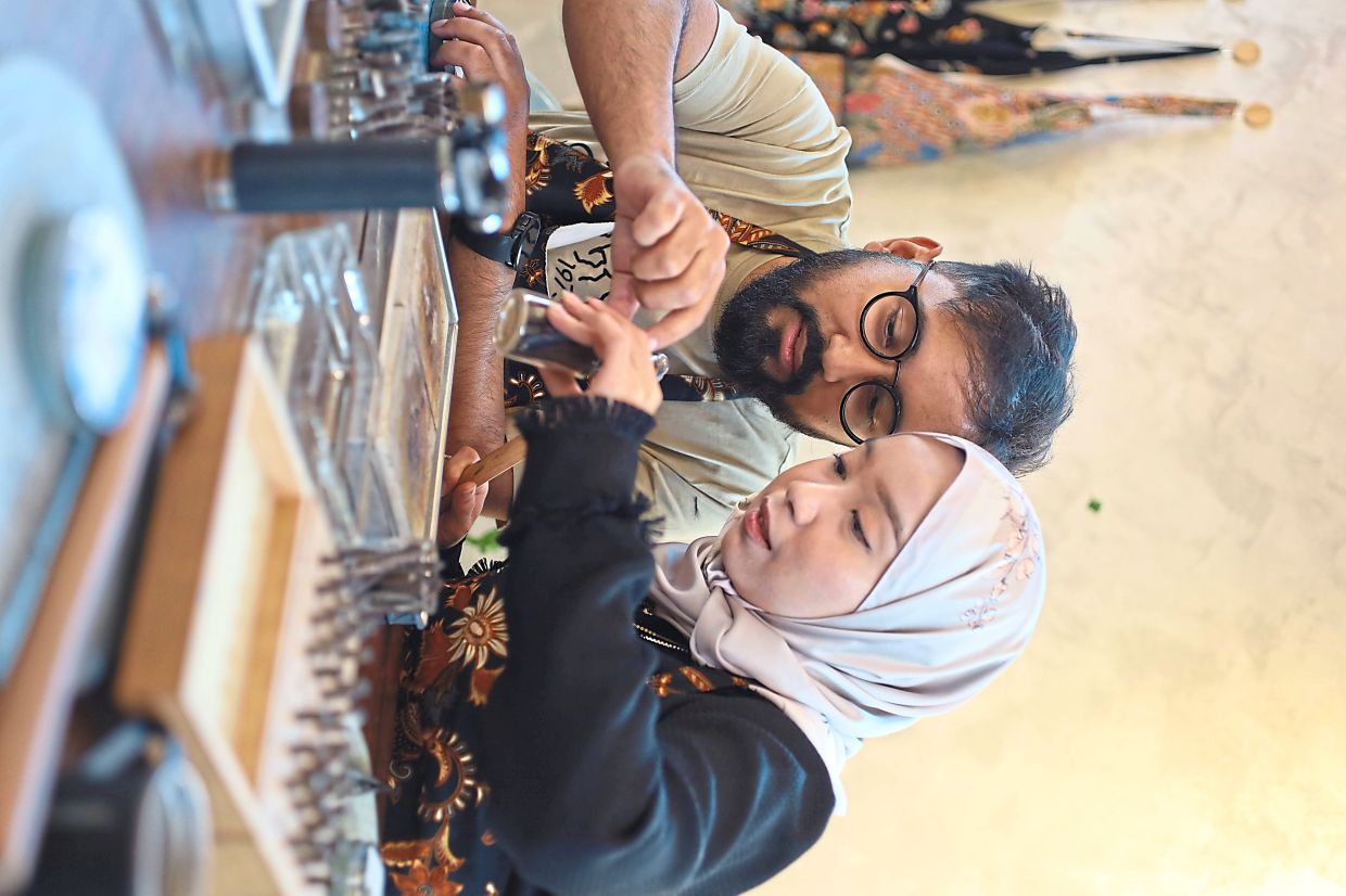 Dr Nayeem (left) and Nurafiqah Syuhada decided to make their wedding rings by hand to add a personal touch to their big day. Photo: Pakanira