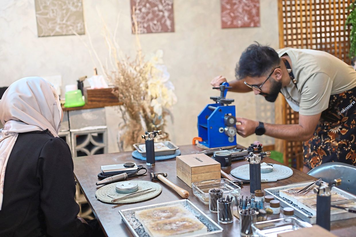 When Dr Nayeem (right) and Nurafiqah Syuhada crafted their own rings, every mark, curve and imperfection became part of their story. Photo: Pakanira