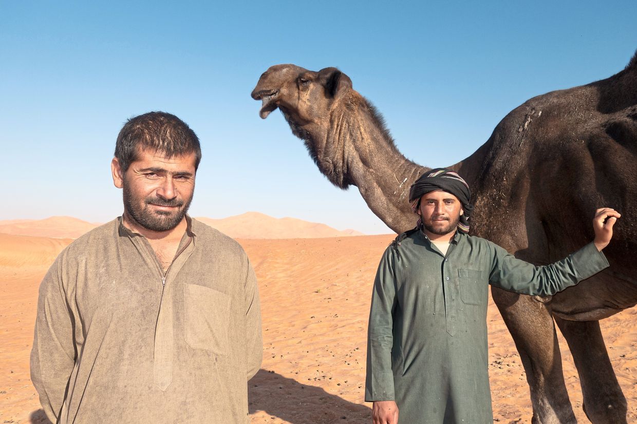 Camel herders Shear (left) and Nasir are from Pakistan and call themselves modern nomads.
