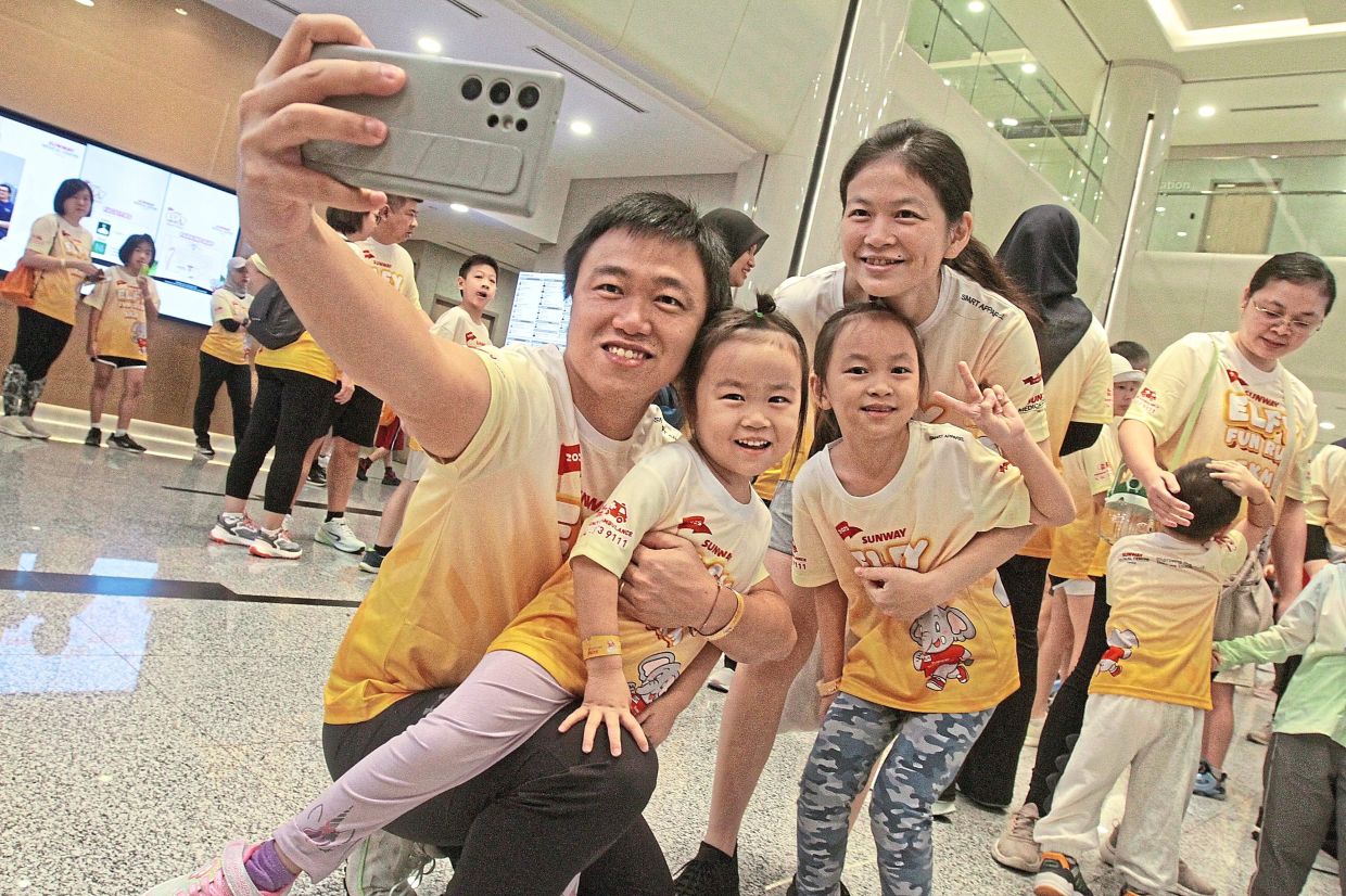 Sho (left) with his wife Yeap and daughters Clarissa, eight, and Elena, four, during the Sunway Elfy Fun Run organised by Sunway Medical Centre Penang. — Photos: LIM BENG TATT/The Star