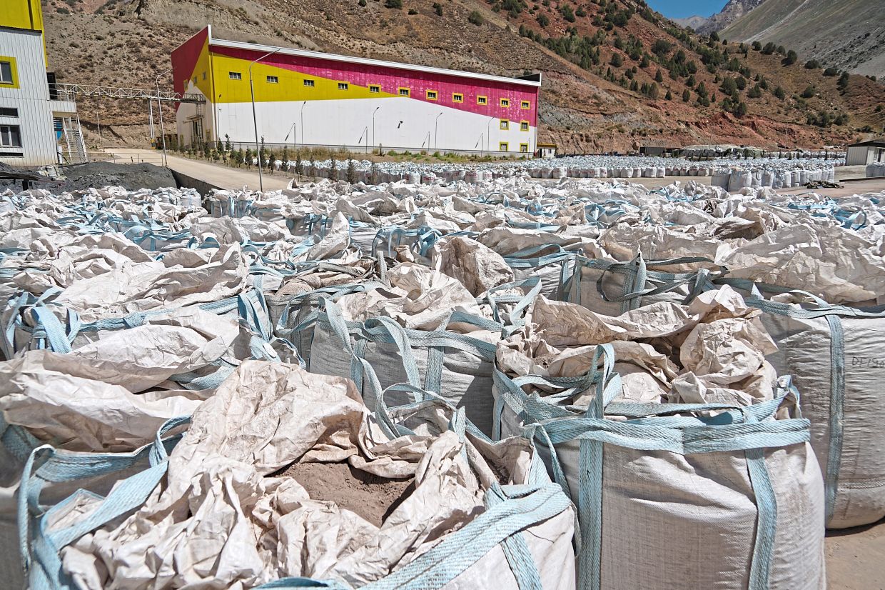 Bags of 30% pure antimony sitting outside a processing facility, ready to be exported and used in the manufacturing of batteries, solar panels and other products and devices. — AFP