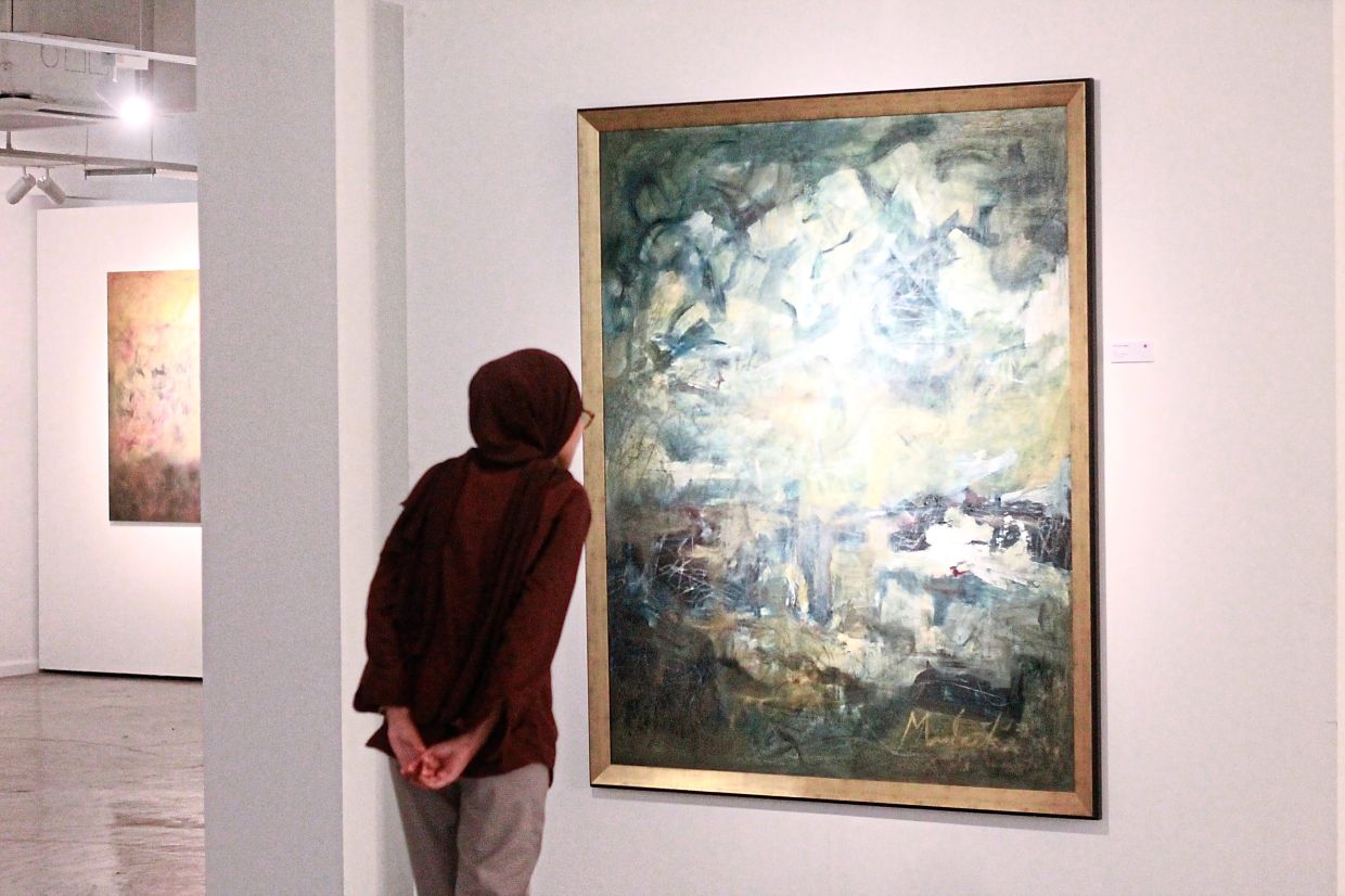 A visitor views Mulaika’s 'All Of The Orient', part of her new series at Harta Space. Photo: The Star/M. Irsyad 