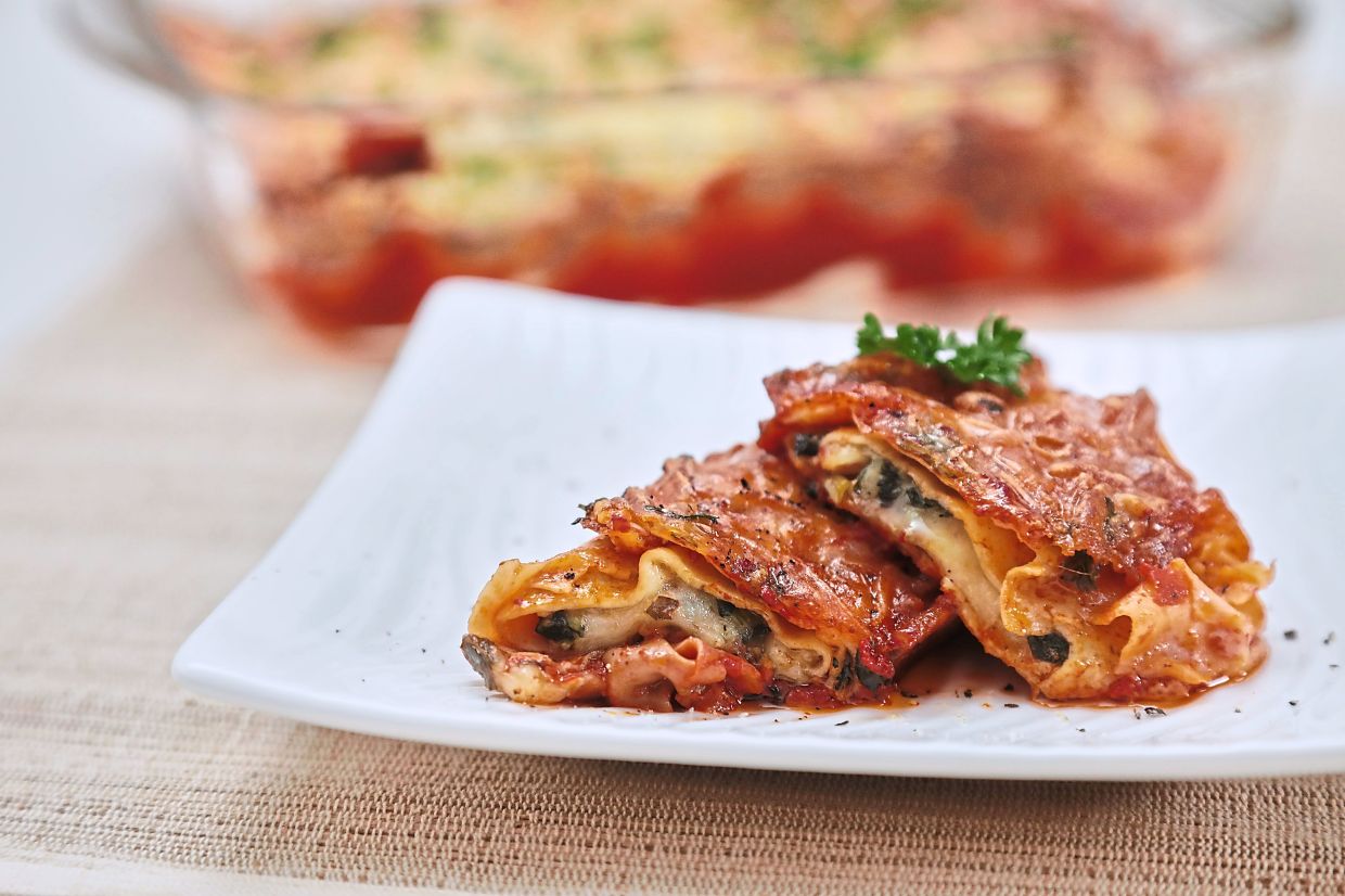 Manicotti is a classic Tuscan dish made with fluffy crepes that are both elastic and tender, filled with cheese and spinach like a vegetarian lasagna. — YAP CHEE HONG/The Star