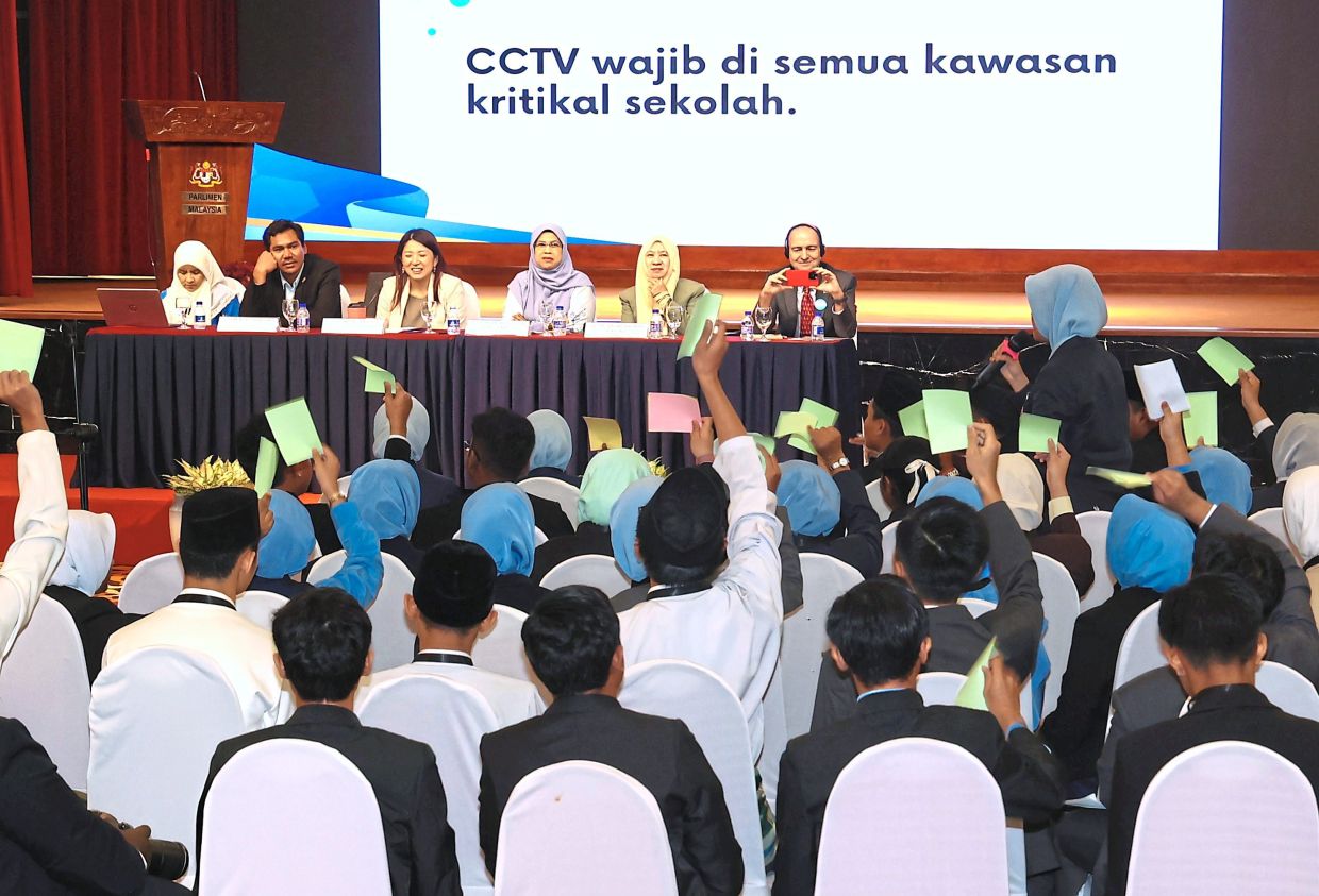 Valuable discusson: (From left) Farah, Mordi, Yeo, Rodziah, Halimah and Gass listening to students attending the Children’s Town Hall in Kuala Lumpur. — ART CHEN/The Star