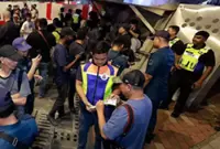 DBKL cracks down on 22 unlicensed pixmen at Petronas Twin Towers