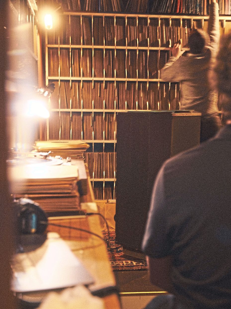 Rivera looks up records on the shelf at the Hot Club of New York. Photo: The New York Times/Ye Fan