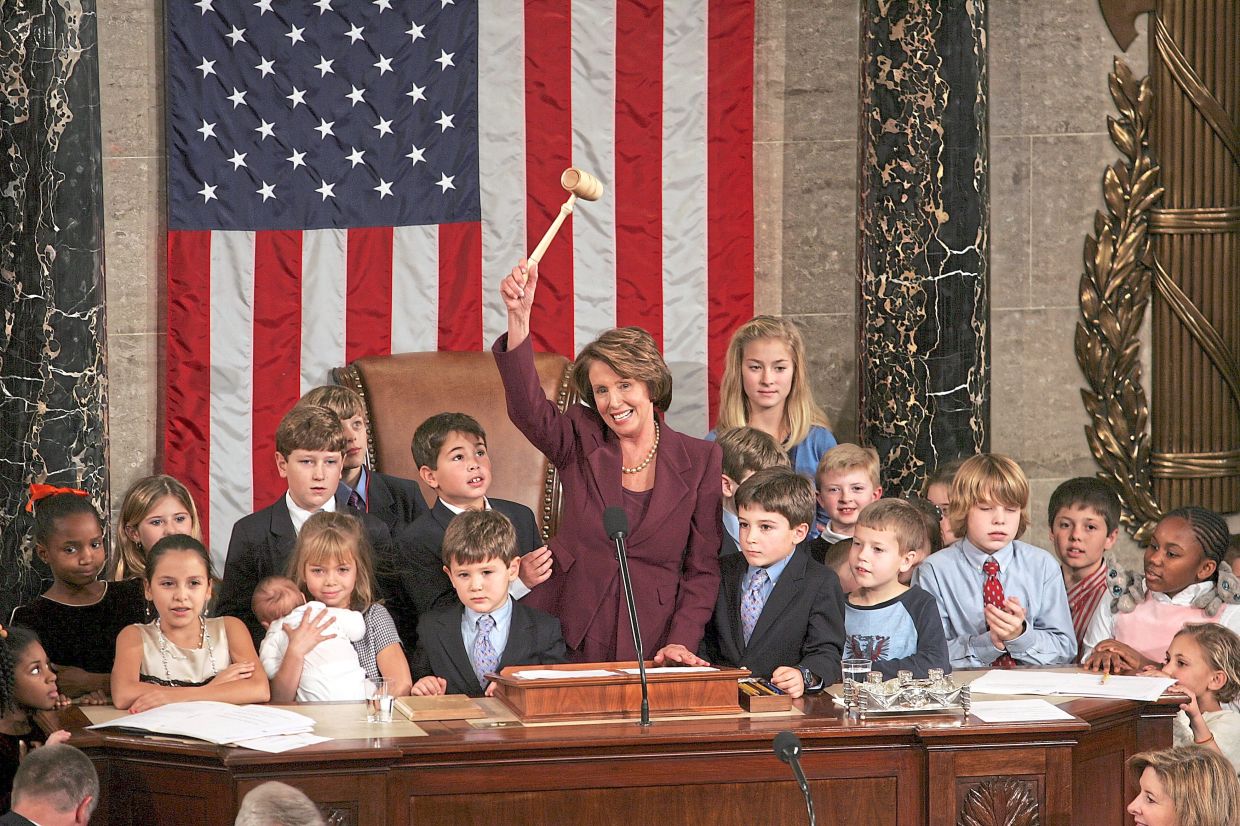 Pelosi opening the 110th Congress, surrounded by lawmakers' children and grandchildren, as she is sworn in as the first female speaker in US history in this filepic from Jan 4, 2007. — Stephen Crowley/The New York Times