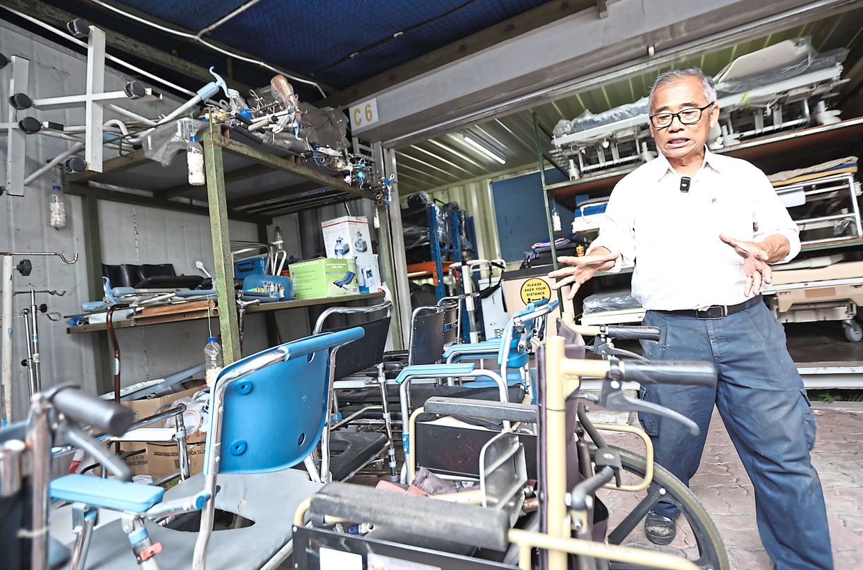 Helping hand: Besides providing food provisions, Chew also leases medical equipment including hospital beds and wheelchairs to those in need for free. — AZMAN GHANI/The Star