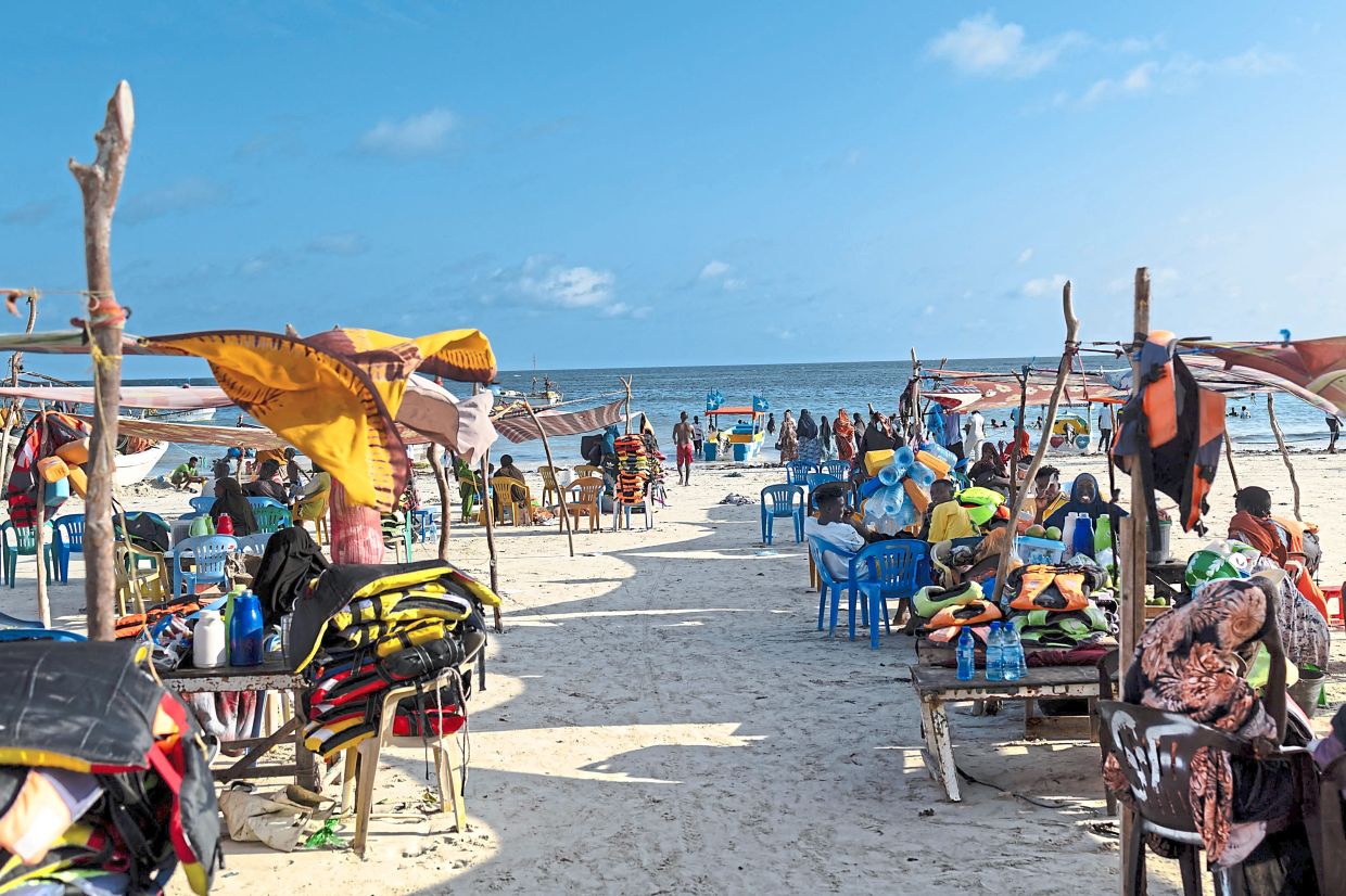 Vendors hawking food and flotation devices waiting for visitors at Lido beach.
