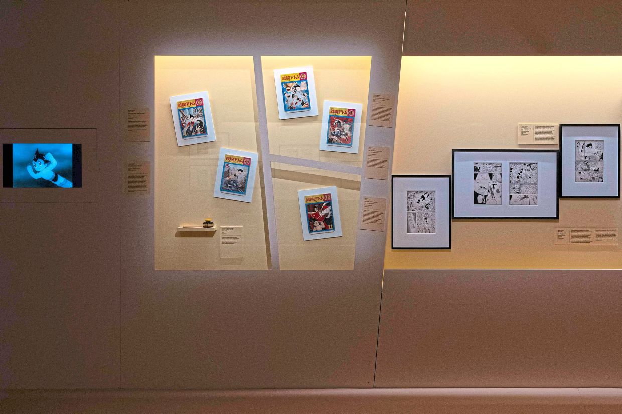 An exhibition wall dedicated to the 'Astro Boy' manga series by Japanese manga artist Osamu Tezuka. Photo: AFP