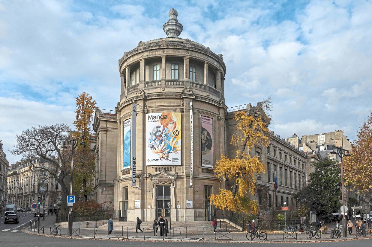 The entrance of Paris’ Guimet Museum, featuring the poster for 'Manga. An Art Of Its Own!' exhibition, running until next March. Photo: AFP