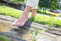 Barefoot walking has a host of benefits, including strengthening your muscles