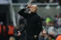Soccer-Man City's Guardiola apologises for confrontation with cameraman