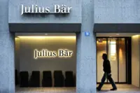 Julius Baer warns on profit after loan charge