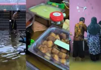 Floods no damper to Perak family's celebration of son's first birthday