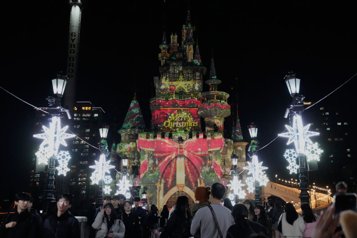Lights are up at Lotte World Adventure theme park, decorated for the upcoming Christmas season in Seoul, South Korea, on Wednesday, Nov 26, 2025. -- AP Photo/Ahn Young-joon