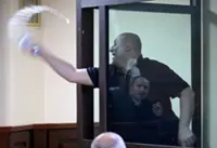 Jailed Georgian opposition politician gets extra sentence for splashing water at judge