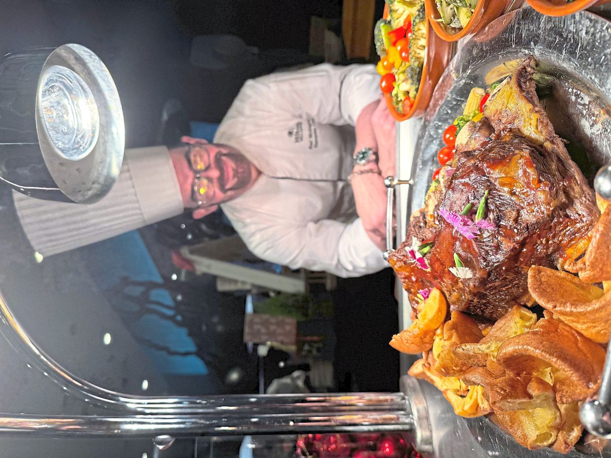 Mcloughlin showing off the beef ribs with Yorkshire pudding.