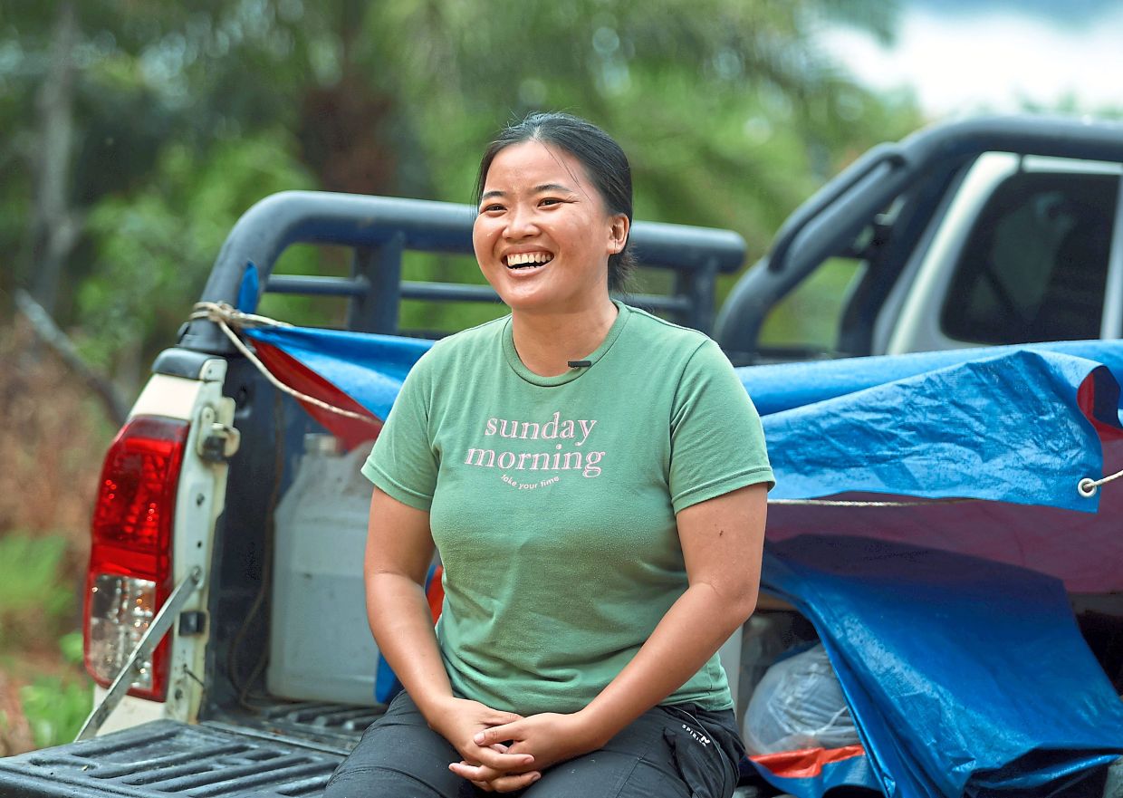 Volunteer Madeline Jison, from Tongod, joined Lightup after discovering the group on Facebook. She helped install solar panels for 100 homes in Kampung Paus and saw how light transformed daily life. -KAMARUL ARIFFIN/TheStar