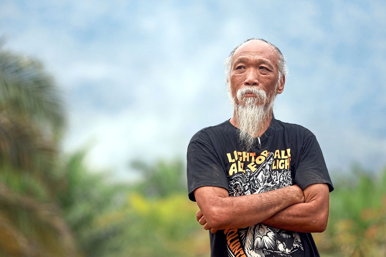 Doing their part: Ong and a small team of volunteers had installed three micro-hydro power systems in Ulu Bengoh by 2014. (Right) Jison joined Lightup after discovering the group on Facebook. She helped install solar panels for 100 homes in Kampung Paus.