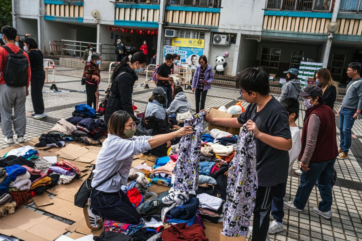 'Very worried': Hong Kong fire survivors hunt for the missing