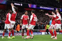 Soccer-Arsenal stun Bayern Munich to seize Champions League top spot