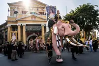 Pink elephants march for Thailand's late queen mother