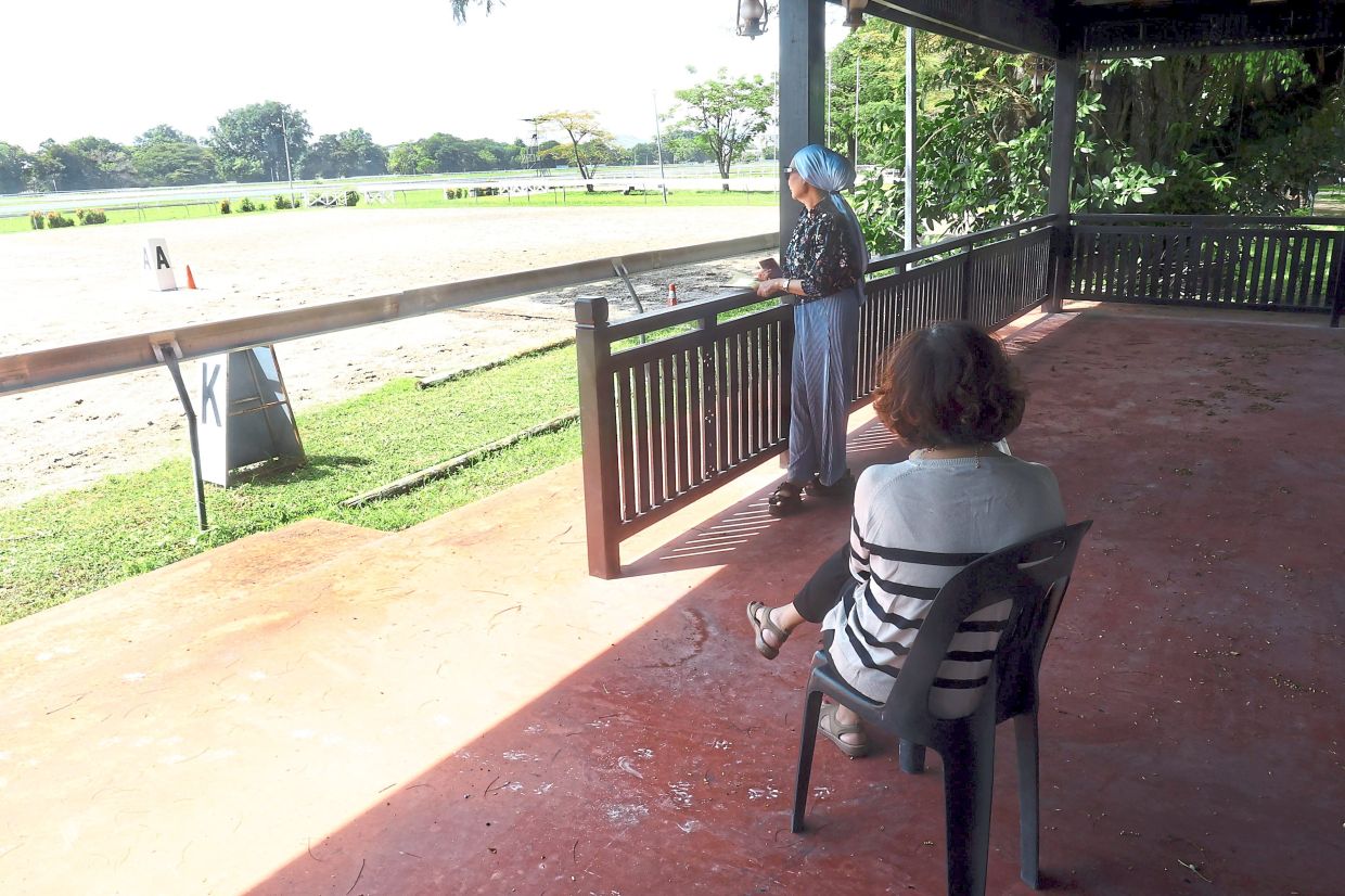 Yip and Norhasliza taking a break at the pavilion.