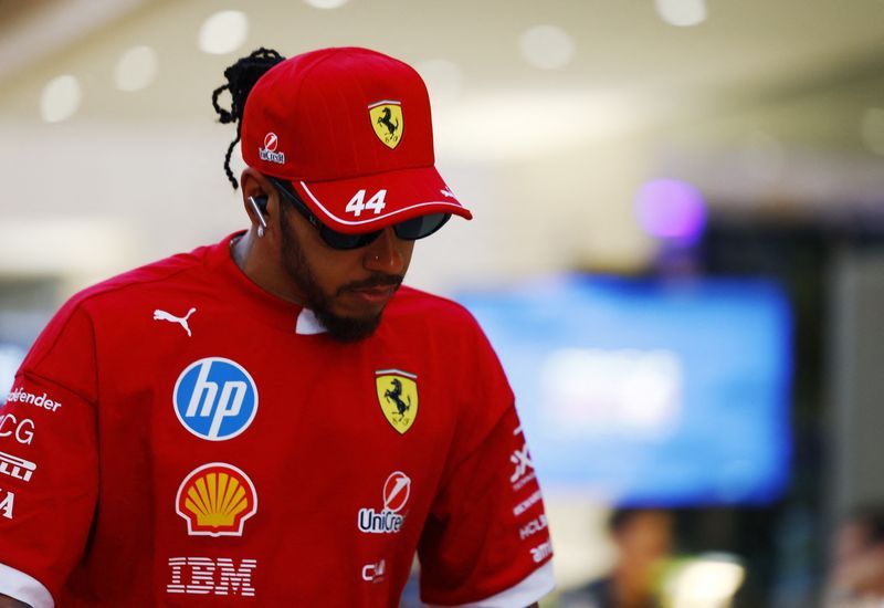Motor racing-No regrets about moving to Ferrari, says Hamilton