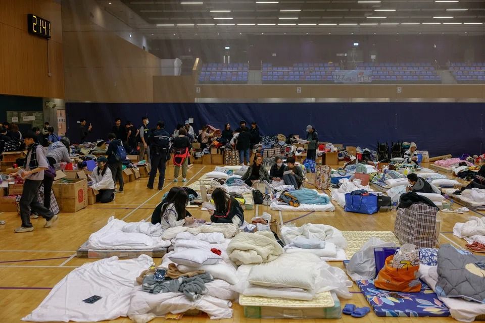 People shelter at an evacuation centre on Nov 27. - Photo: Reuters
