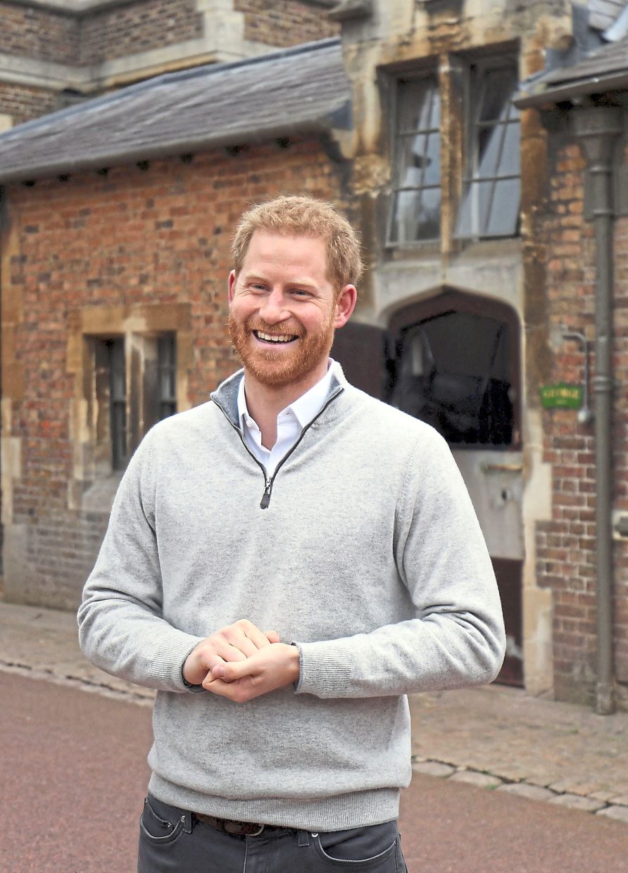 Prince Harry, wearing a quarter-zip, speaks to members of the media at Windsor Castle in 2019, following the announcement that his wife, Meghan, Duchess of Sussex has given birth to a son. Photo:AFP