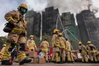 Hong Kong tower fire death toll rises to 128 as 200 remain missing