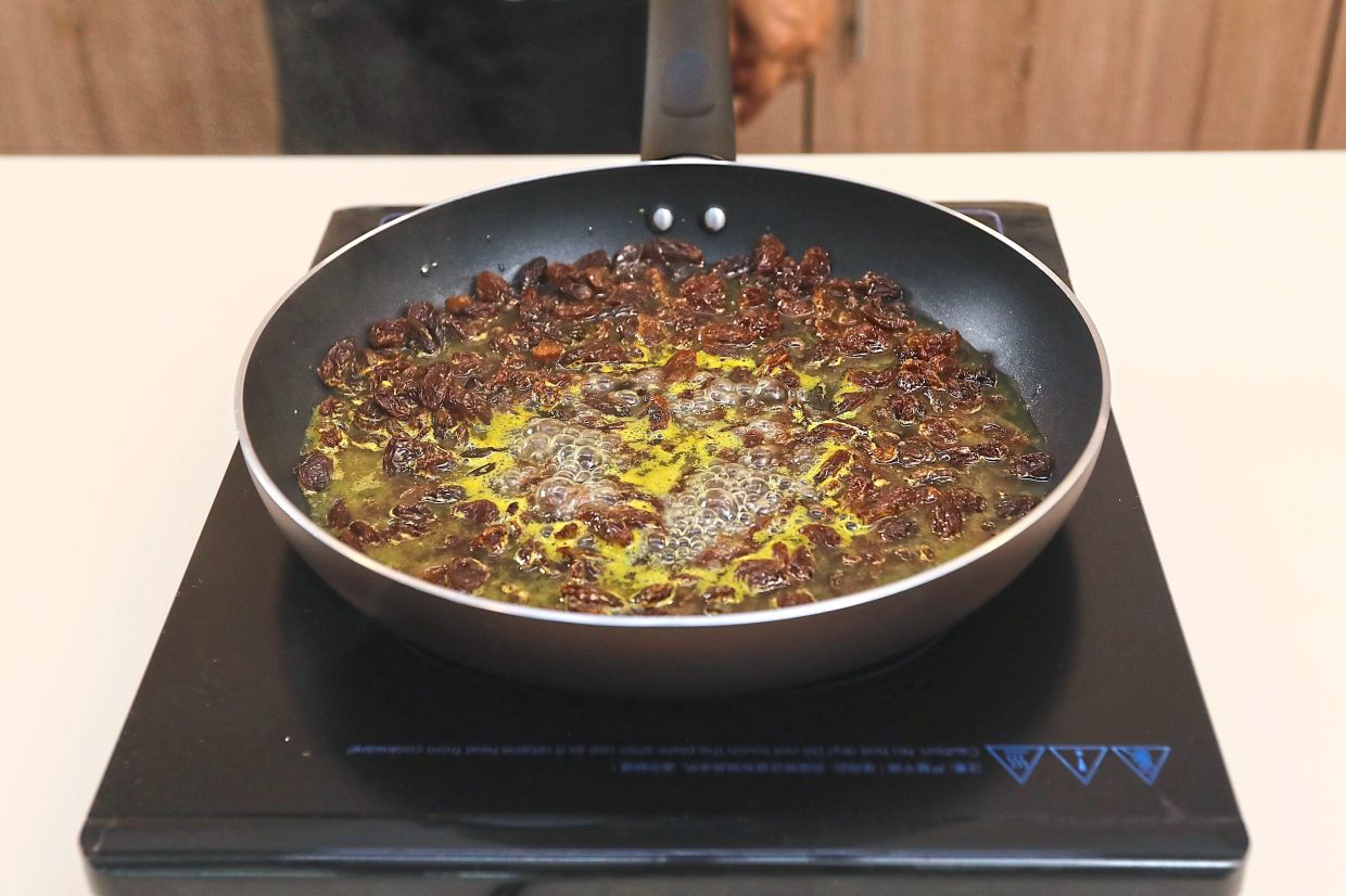 Simmer the raisins with orange juice until they soften and plump up, then lay out on kitchen towel to dry.