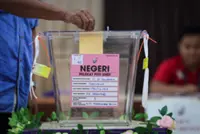 Sabah polls: Voters brave morning drizzle as centres open