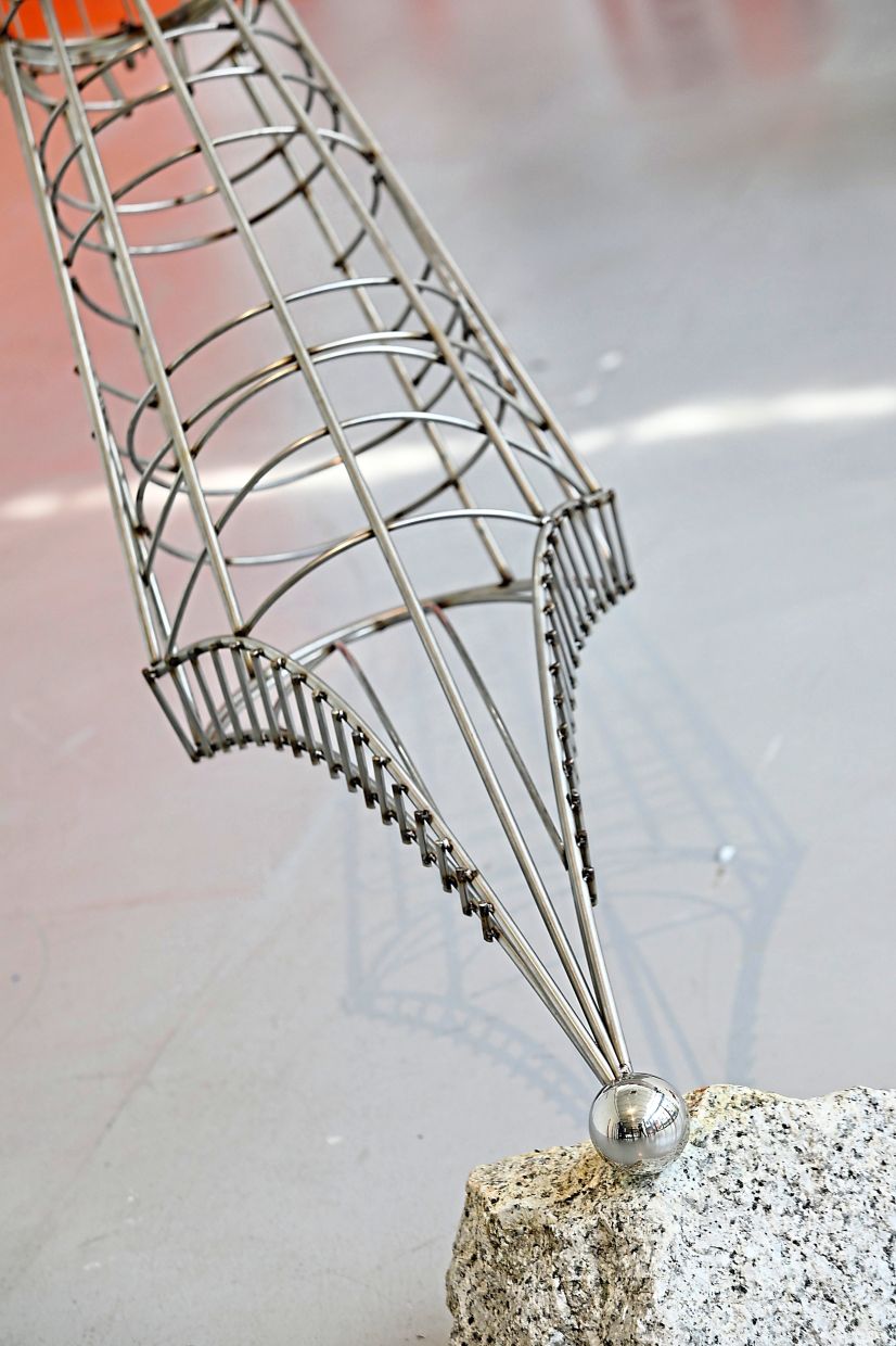 A closer look at veteran artist Ramlan Abdullah's stainless steel sculpture resting on granite titled 'Kalam Trap'. Photo: The Star/Low Lay Phon
